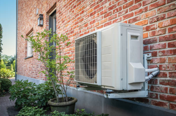 Wall Mounted Outdoor Air Conditioning Unit On Brick Home